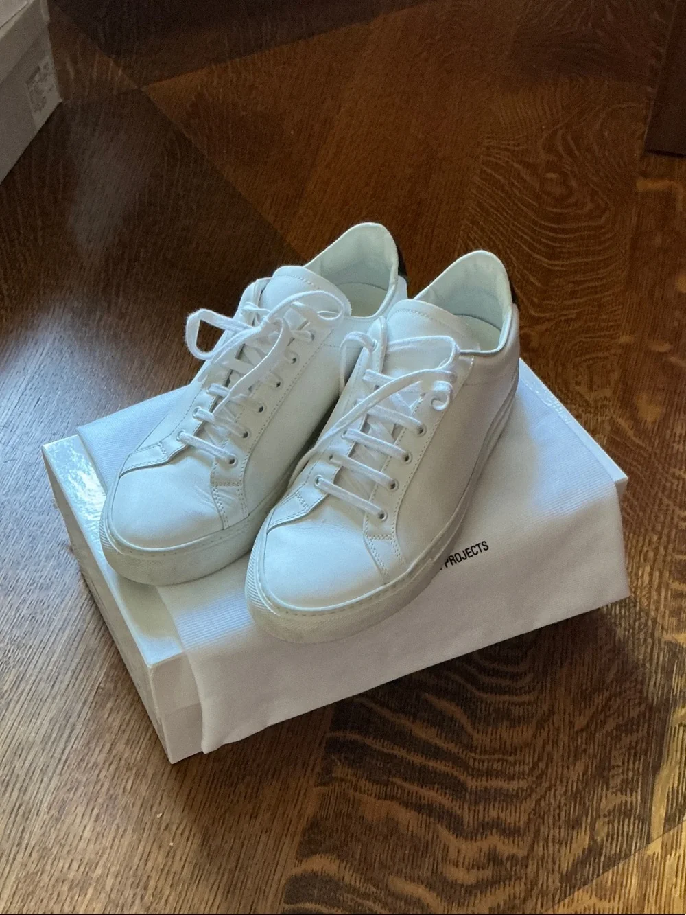 Women by Common Projects Women‘s White Leather Sneaker
